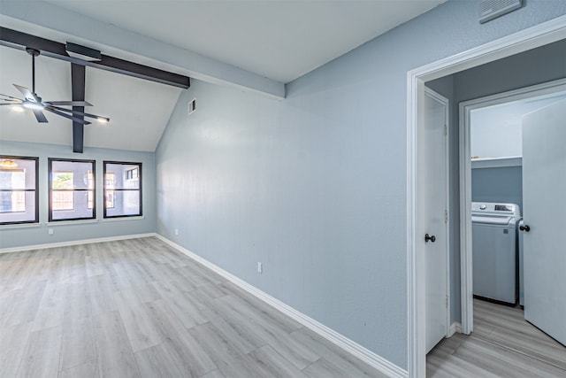 unfurnished room with washer / clothes dryer, ceiling fan, vaulted ceiling with beams, and light wood-type flooring