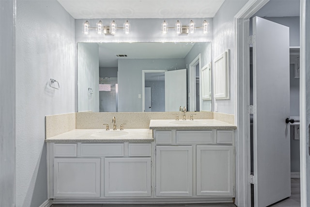 bathroom with hardwood / wood-style floors and vanity