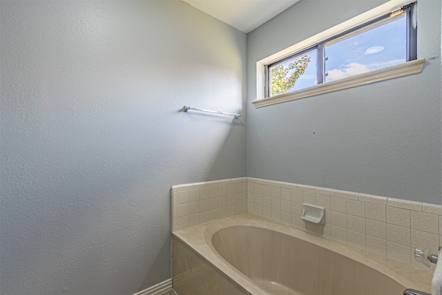 bathroom featuring a washtub