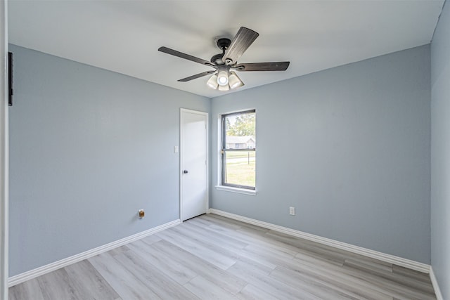 empty room featuring light wood-type flooring and ceiling fan