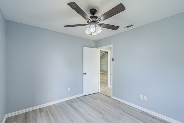 spare room with ceiling fan and light hardwood / wood-style flooring