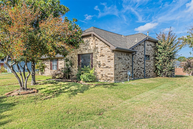 view of property exterior featuring a lawn