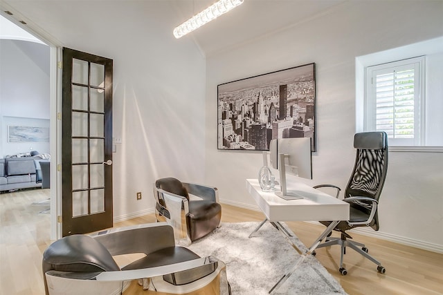 home office featuring french doors and light wood-type flooring