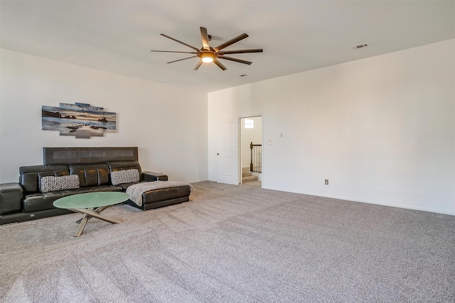 carpeted living room featuring ceiling fan