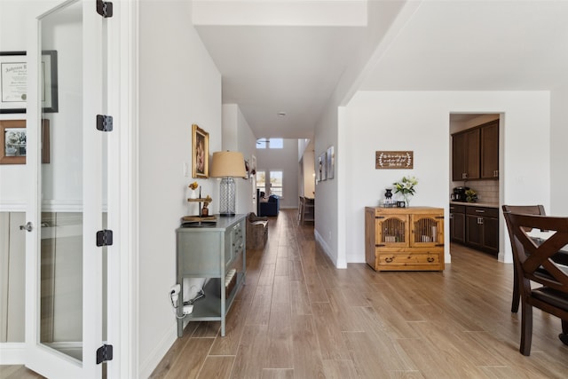 corridor featuring light wood-type flooring