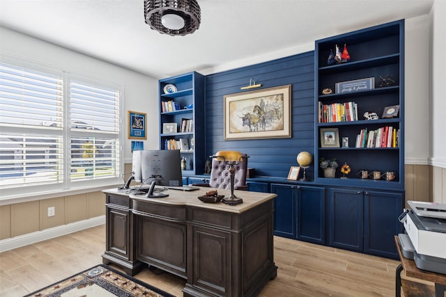 hallway with baseboards and light wood-style floors