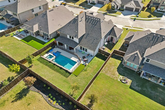 view of pool featuring a fenced in pool, a fenced backyard, ceiling fan, an in ground hot tub, and a patio area