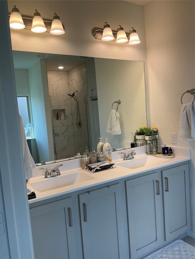 bathroom featuring vanity and a tile shower