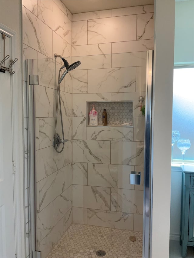 bathroom featuring plenty of natural light and walk in shower