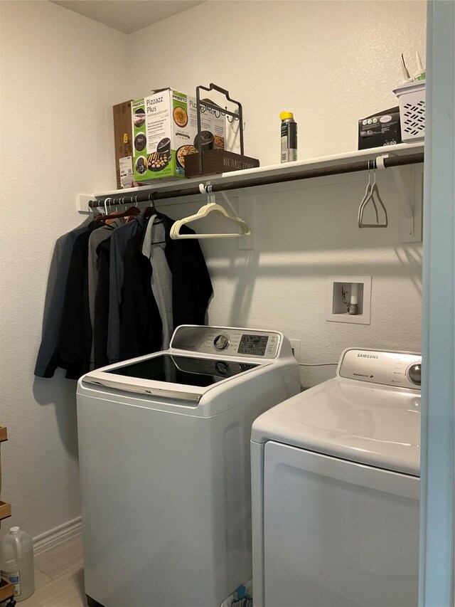 washroom featuring washing machine and dryer