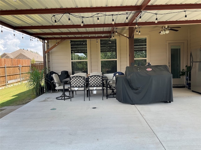 view of patio with area for grilling and ceiling fan