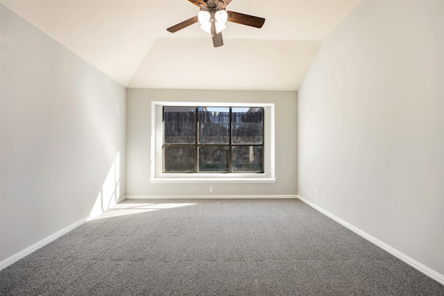 spare room with ceiling fan, lofted ceiling, and carpet floors