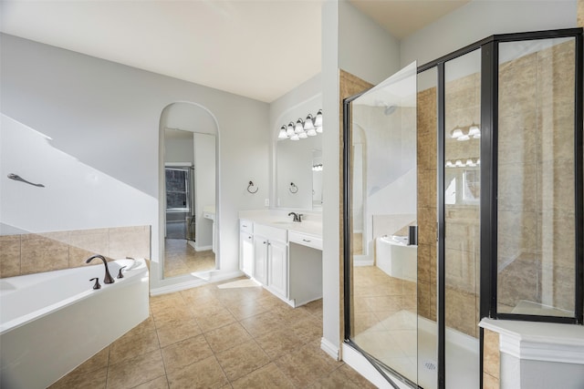 bathroom with vanity, tile patterned floors, and separate shower and tub