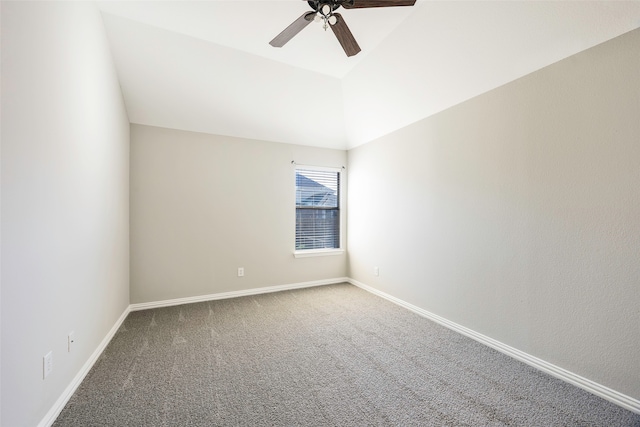 carpeted empty room featuring ceiling fan and lofted ceiling