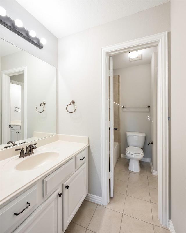 full bathroom with toilet, vanity, tile patterned floors, and shower / bathtub combination