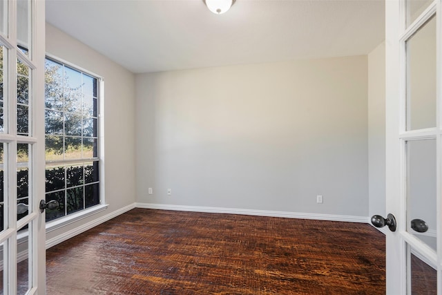 2280 Riviera Dr, Little Elm, TX 75068 - unfurnished room featuring baseboards, dark wood-style floors, and french doors