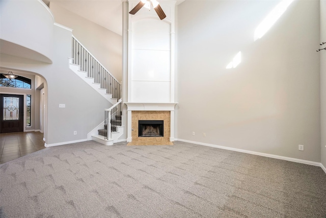 2280 Riviera Dr, Little Elm, TX 75068 - unfurnished living room with carpet, a high ceiling, stairway, baseboards, and a ceiling fan