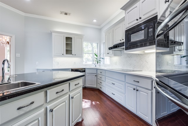 kitchen with black appliances, crown molding, sink, dark hardwood / wood-style floors, and white cabinetry