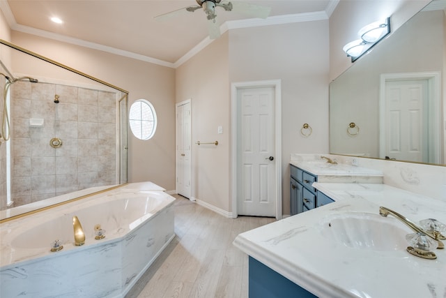 bathroom featuring ceiling fan, crown molding, a bathtub, vanity, and hardwood / wood-style flooring