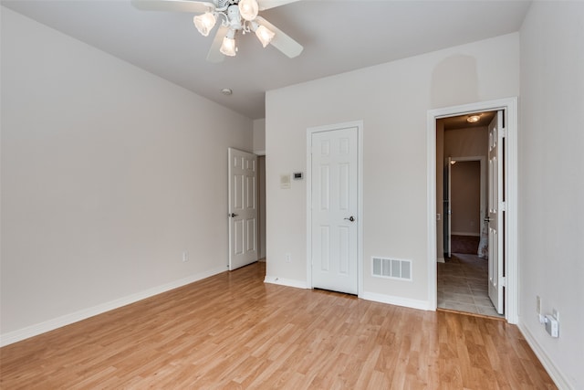 unfurnished bedroom with light wood-type flooring and ceiling fan