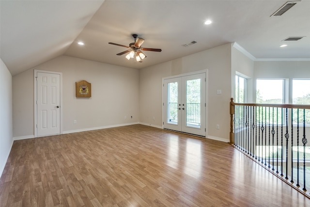 spare room featuring ceiling fan, french doors, crown molding, light hardwood / wood-style floors, and vaulted ceiling