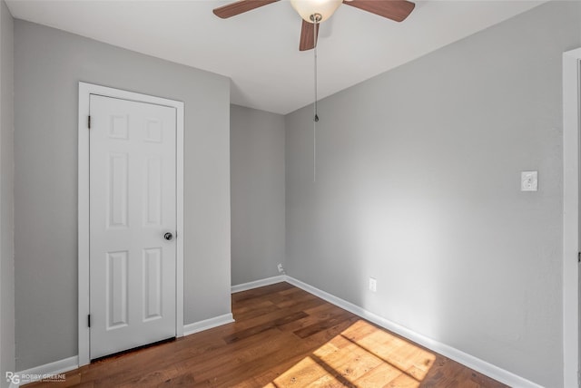 unfurnished room with ceiling fan and wood-type flooring