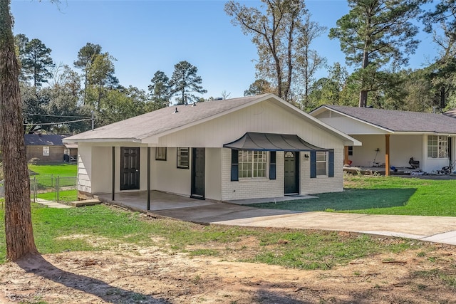 ranch-style home with a front lawn