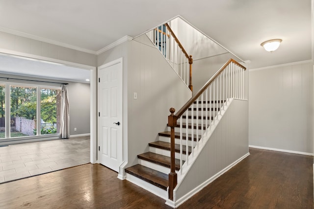 staircase featuring hardwood / wood-style floors and ornamental molding