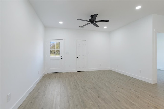 spare room with ceiling fan and light hardwood / wood-style flooring