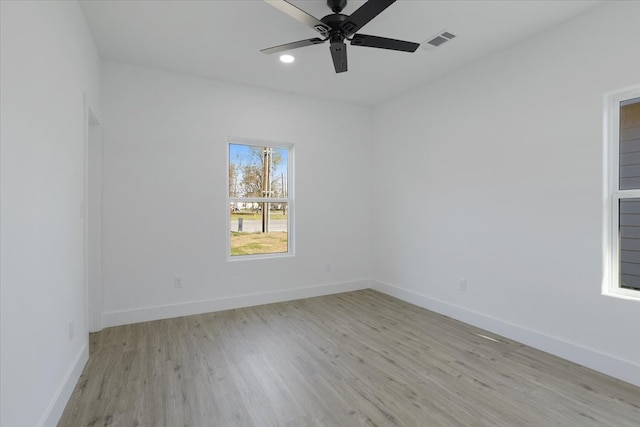 unfurnished room featuring light hardwood / wood-style flooring and ceiling fan