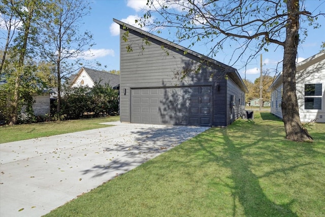 view of property exterior with a yard, an outbuilding, and a garage