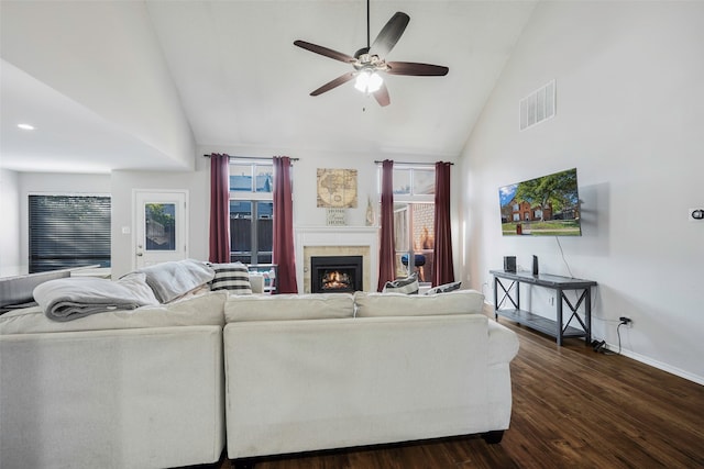 living room featuring high vaulted ceiling, dark hardwood / wood-style floors, a healthy amount of sunlight, and ceiling fan