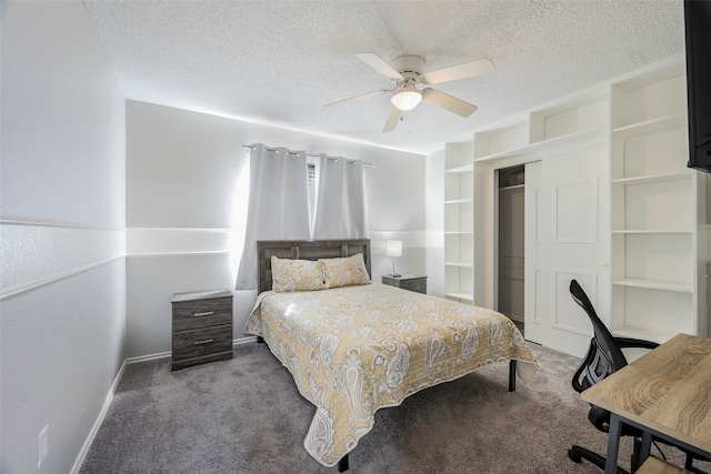 bedroom featuring a textured ceiling, carpet floors, a closet, and ceiling fan