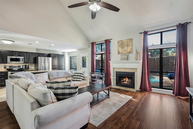 living room featuring high vaulted ceiling, ceiling fan, and dark wood-type flooring