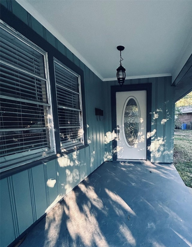 view of exterior entry featuring a porch