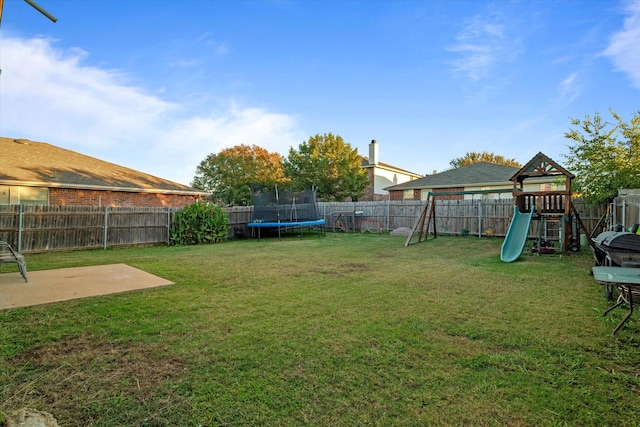 view of yard with a playground, a patio, and a trampoline