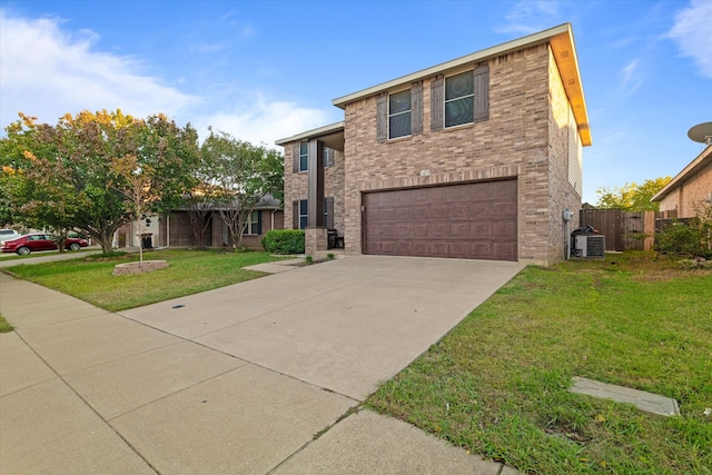 view of front facade with a garage, a front yard, and central air condition unit