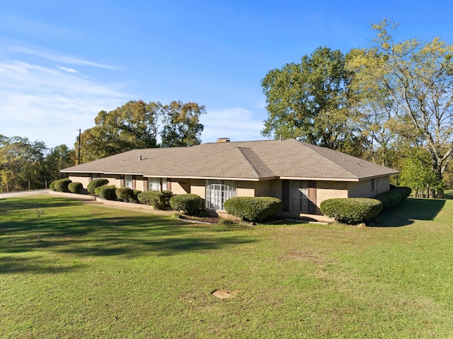 ranch-style house with a front yard