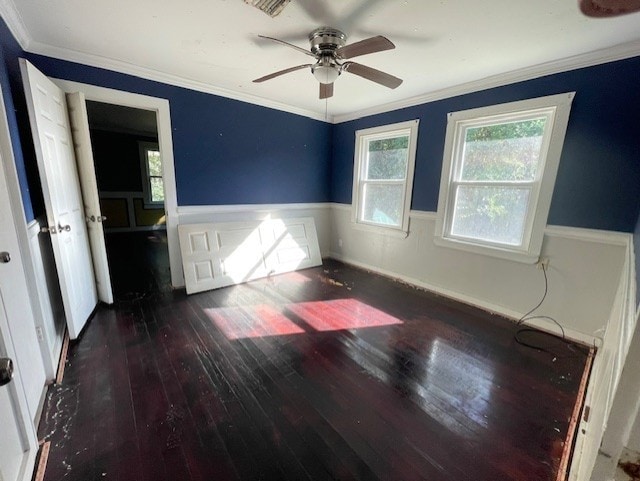 unfurnished bedroom featuring ceiling fan, dark hardwood / wood-style floors, and crown molding