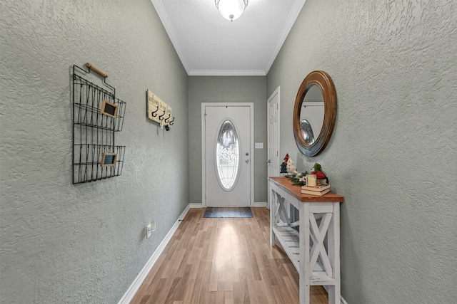 doorway to outside with crown molding and hardwood / wood-style floors