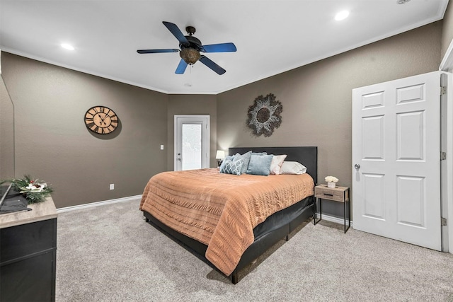 bedroom featuring ceiling fan and light colored carpet