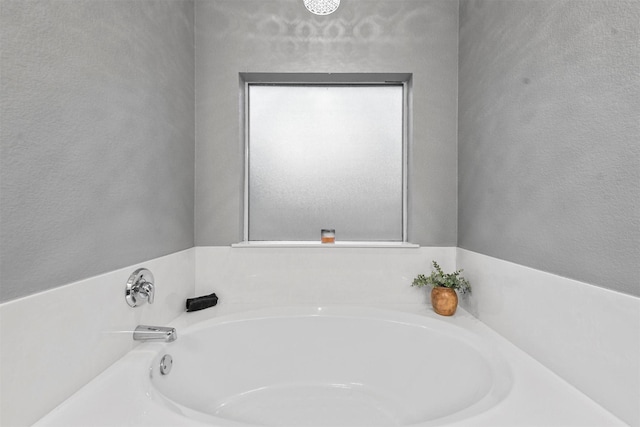 bathroom featuring a tub to relax in