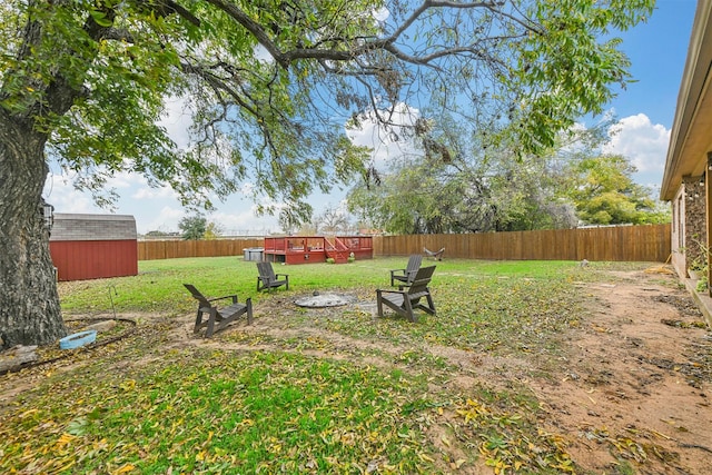 view of yard with an outdoor fire pit