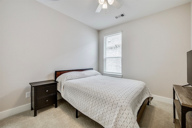 bedroom with light colored carpet and ceiling fan