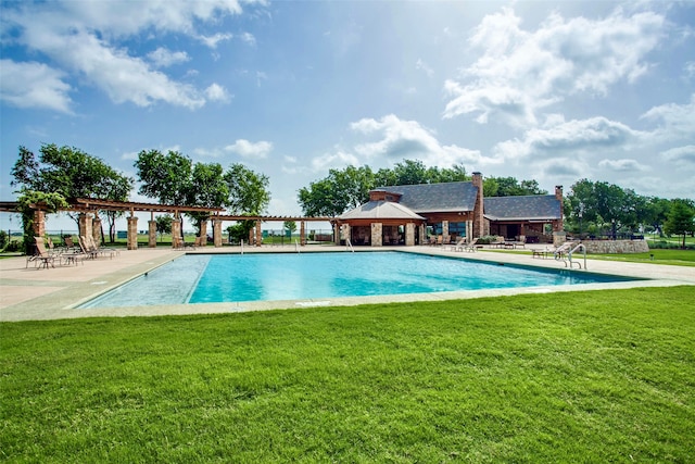 view of pool with a lawn and a gazebo