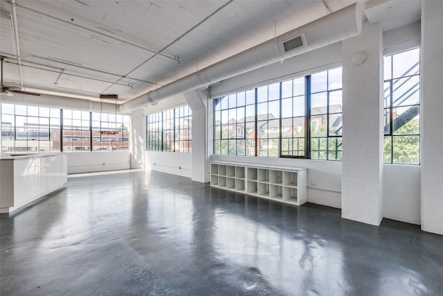 unfurnished room featuring ceiling fan