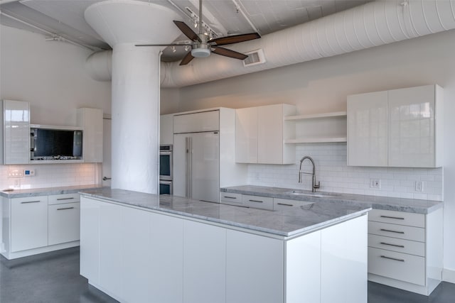 kitchen featuring decorative backsplash, white cabinetry, ceiling fan, and white built in refrigerator