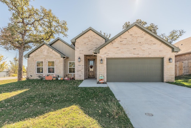 view of front facade with a garage and a front lawn