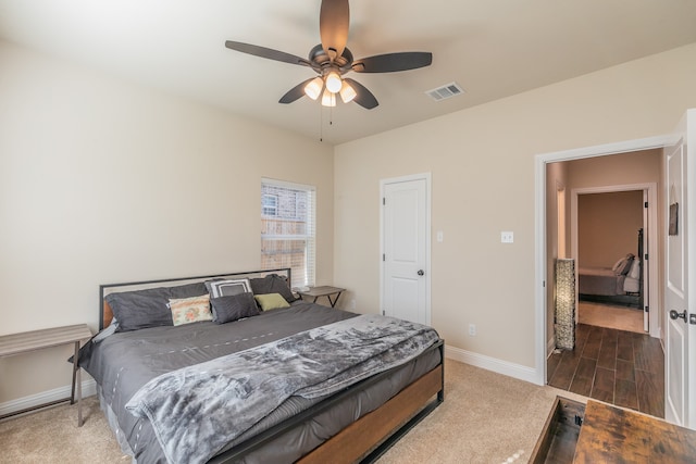 bedroom featuring ceiling fan and dark hardwood / wood-style flooring