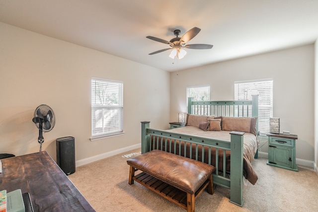 bedroom featuring light carpet and ceiling fan